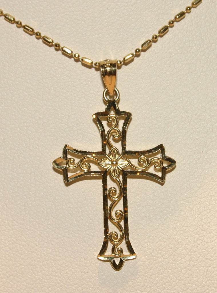 ornate cross pendant
